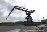 Online Auction of Two Transshipment Cranes 1