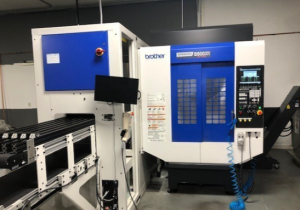 Used Brother Speedio S500X1, new 2020, with 5 axis table and Nachi MZ12 6 axis robotic loader and unloader
