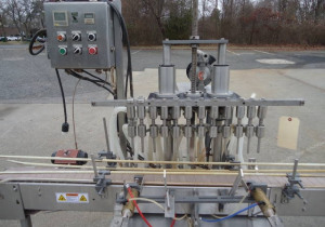 Llenadora automática por gravedad a presión de Jg Machine Works con doce boquillas usadas
