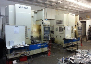 Centro di lavoro verticale CNC Okuma modello MX-45VAE. Nuovo 2007