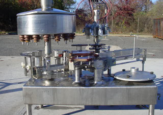 Riempitrice/tappatrice per liquidi rotativa a 16 teste Fogg usata, tutto in acciaio inossidabile