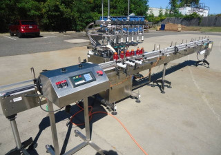 Used Inline Filling Systems Six Head Level Head Overflow Pressure Filler With 20 Ft. Conveyor