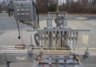 Used Jg Machine Works Twelve Spout Automatic Pressure Gravity Filler