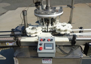 Used Mrm Versafil Twelve Spout Rotary Positive Displacement Filler With Conveyor
